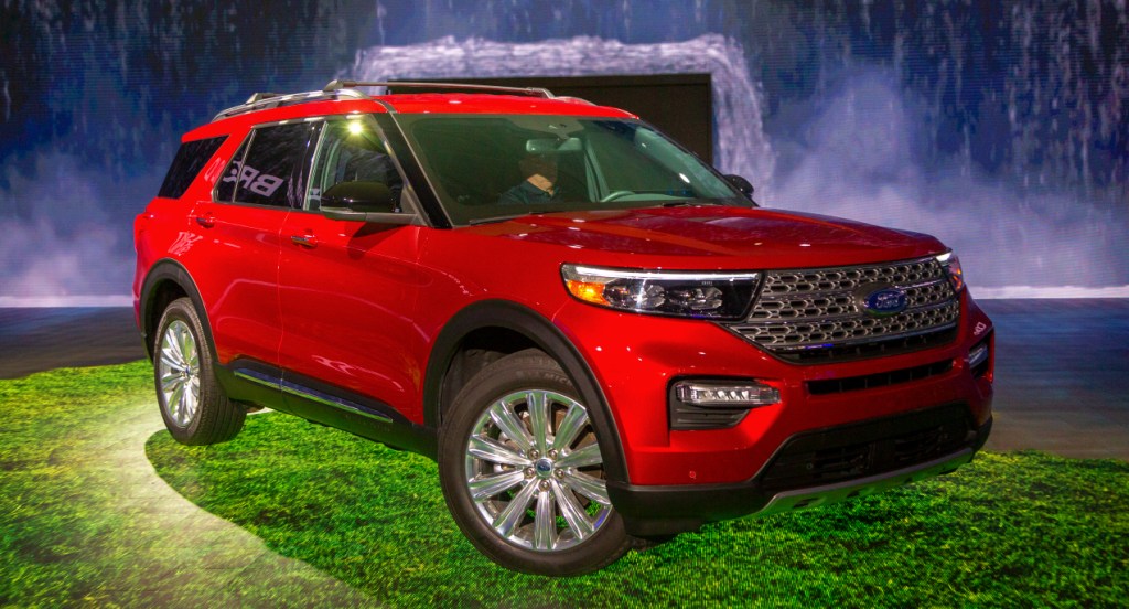 A red Ford Explorer is on display.