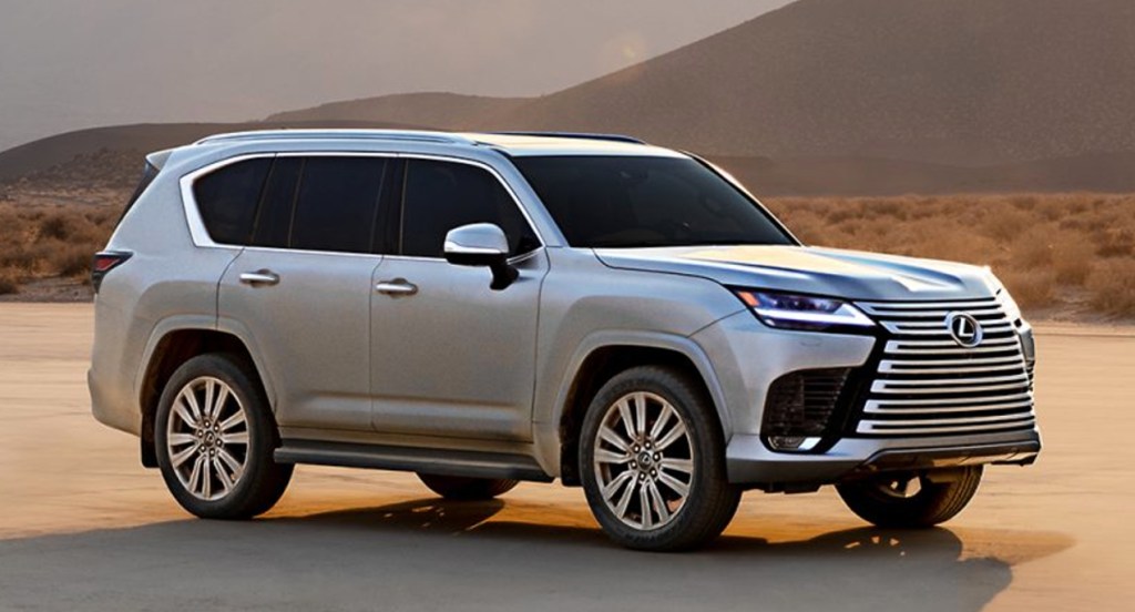 A silver 2022 Lexus LX600 is parked in the sand. 