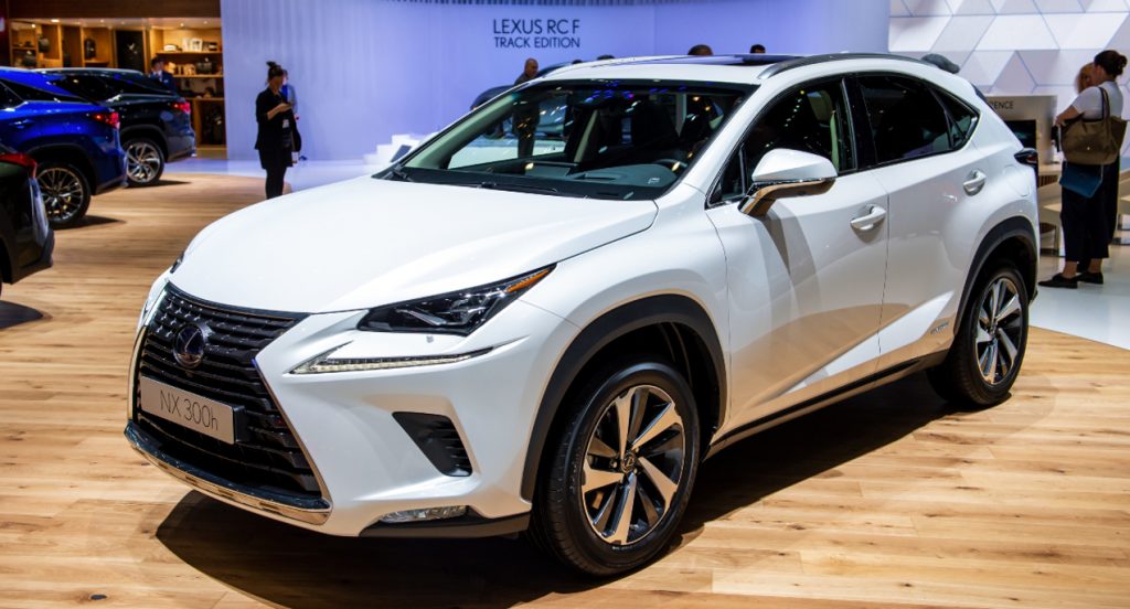 A white Lexus NX crossover is on display. 