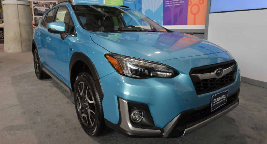 A blue Subaru Crosstrek is on display. 
