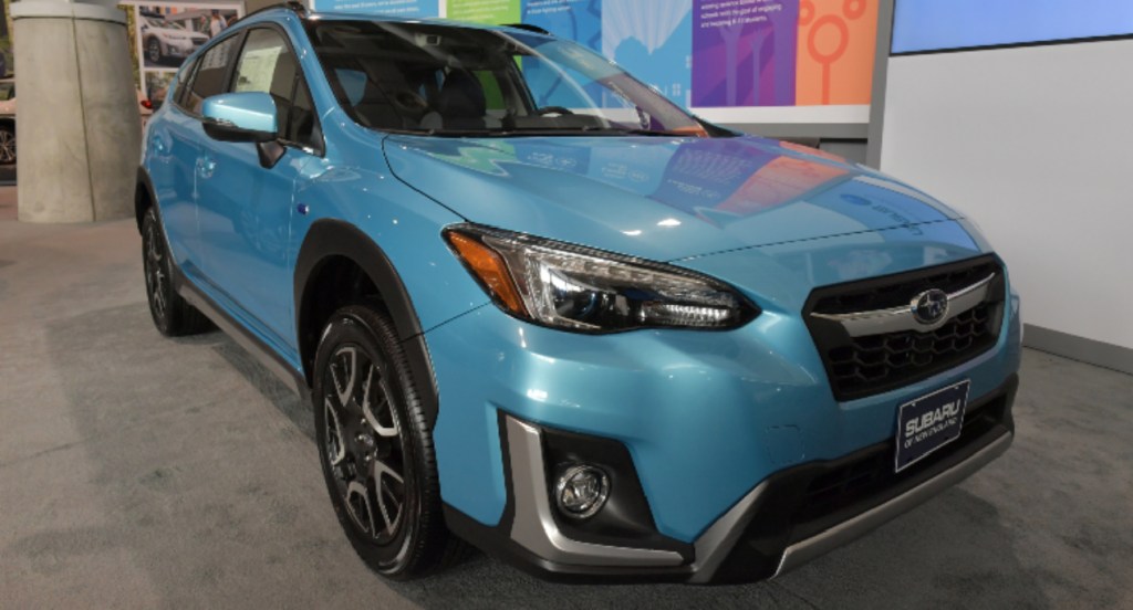 A blue Subaru Crosstrek is on display.