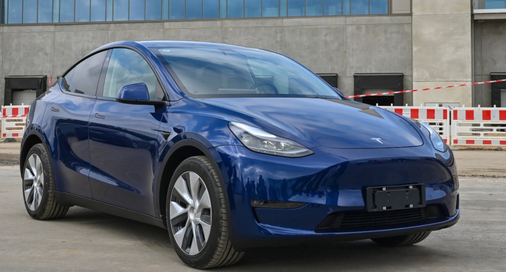 A Tesla Model Y in blue parked. A model just like this used Tesla's Sentry Mode to capture footage of an armed robbery