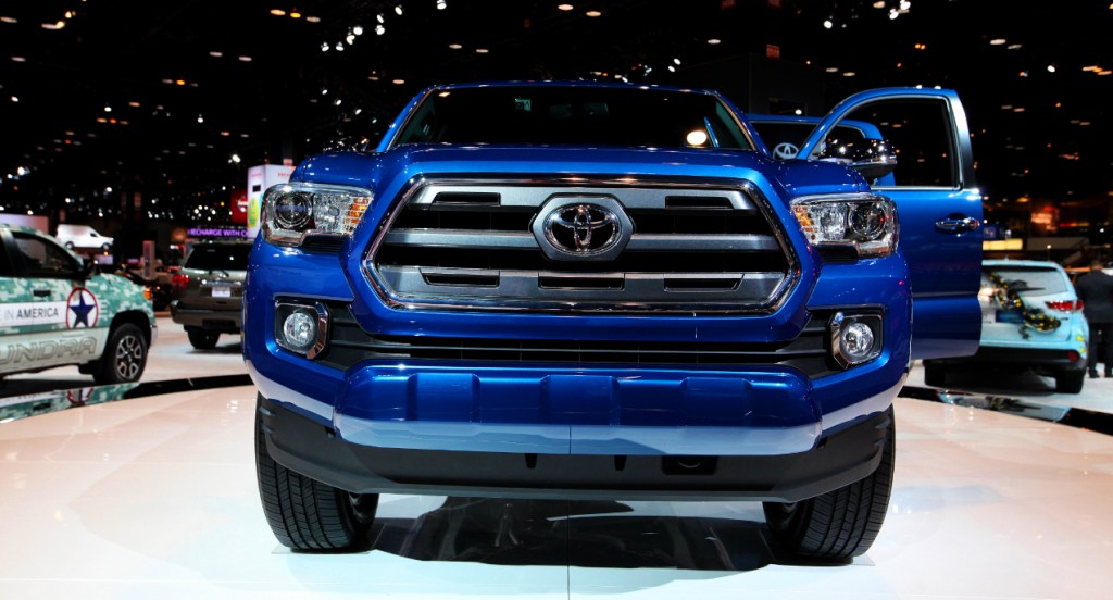 A blue Toyota Tacoma is on display.