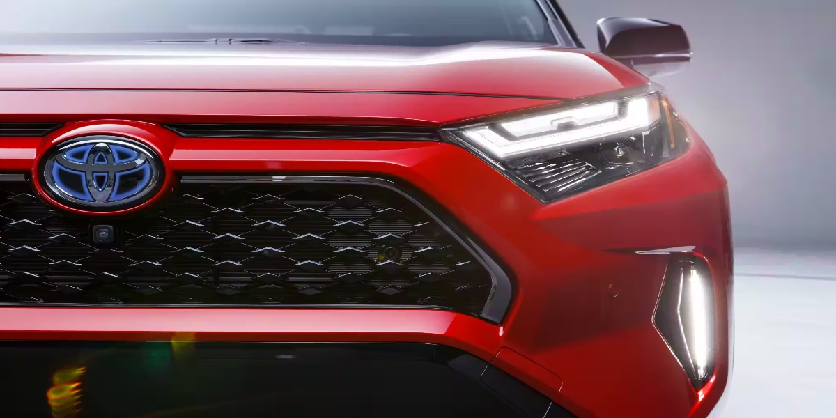The front of a red Toyota RAV4 Prime small SUV.