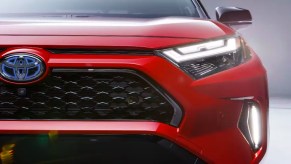 The front of a red Toyota RAV4 Prime small SUV.