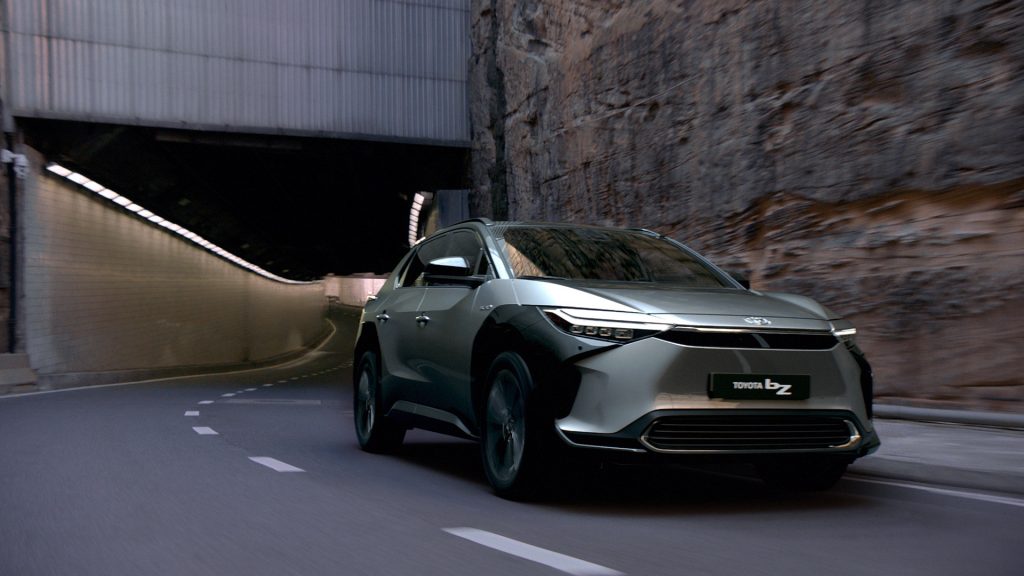 Toyota bZ4X electric suv driving out of a tunnel.