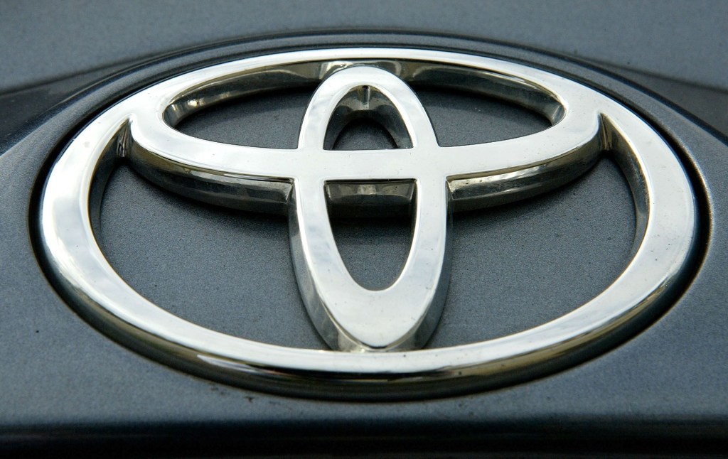 Toyota logo on a black background as found on a Toyota Land Cruiser. 