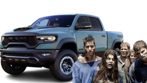 A blue Ram 1500 TRX surrounded by zombies.