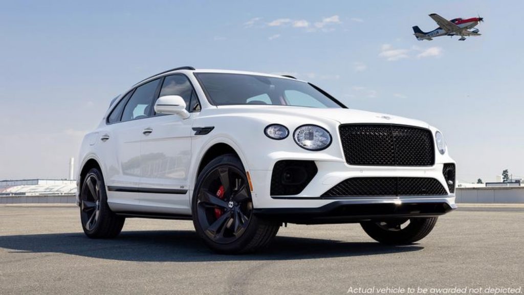 White 2021 Bentley Bentayga parked on an airport runway