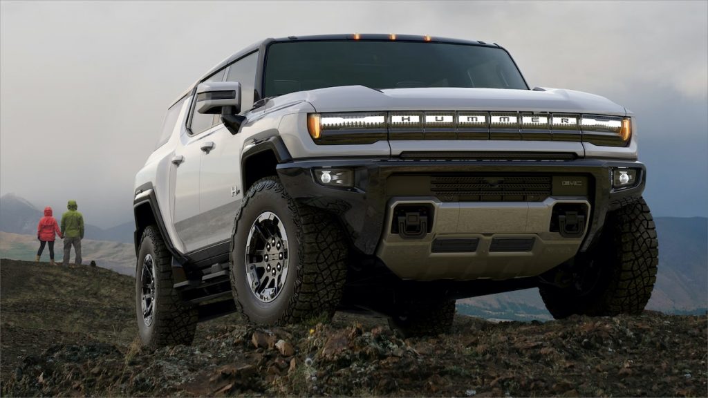 White GMC Hummer EV Pickup parked on mountainous terrain