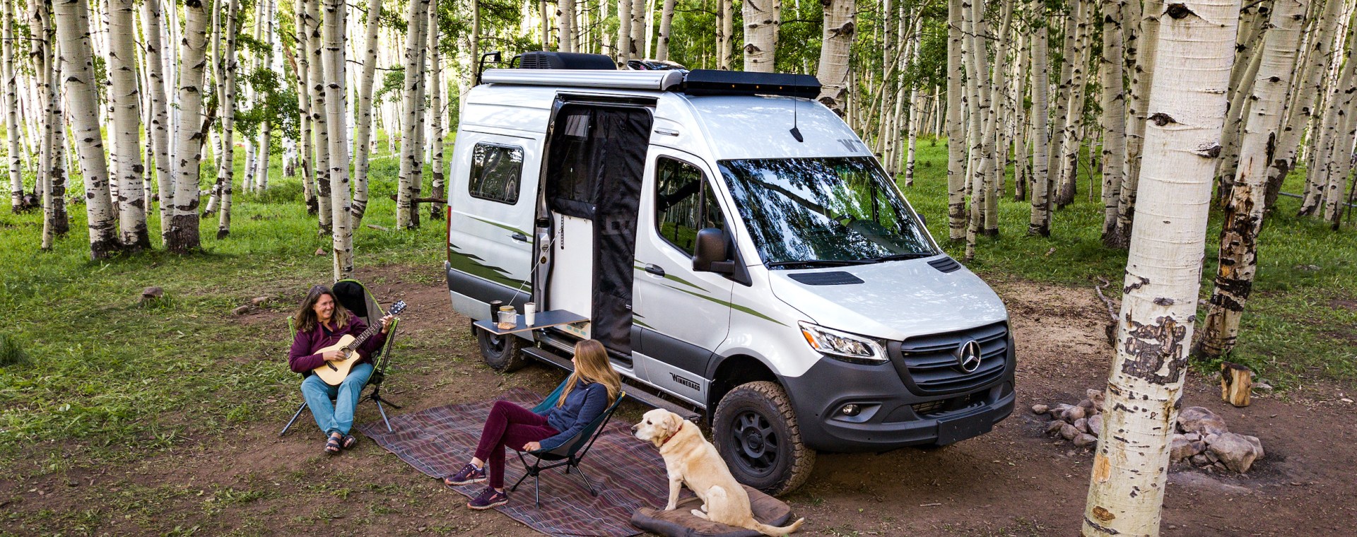 Winnebago camper van set up outdoors