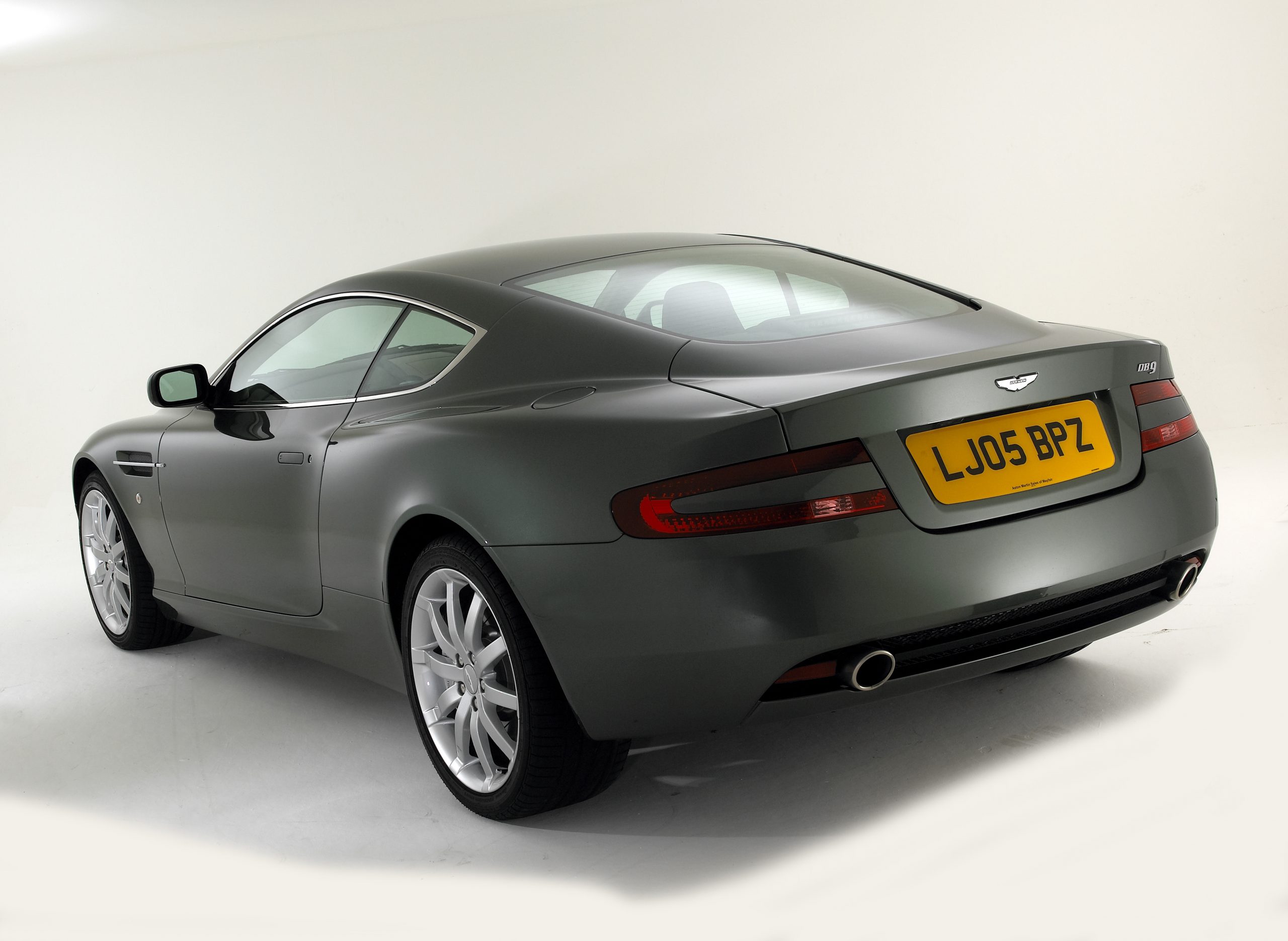 The rear 3/4 of the Aston Martin DB9 shot in a studio