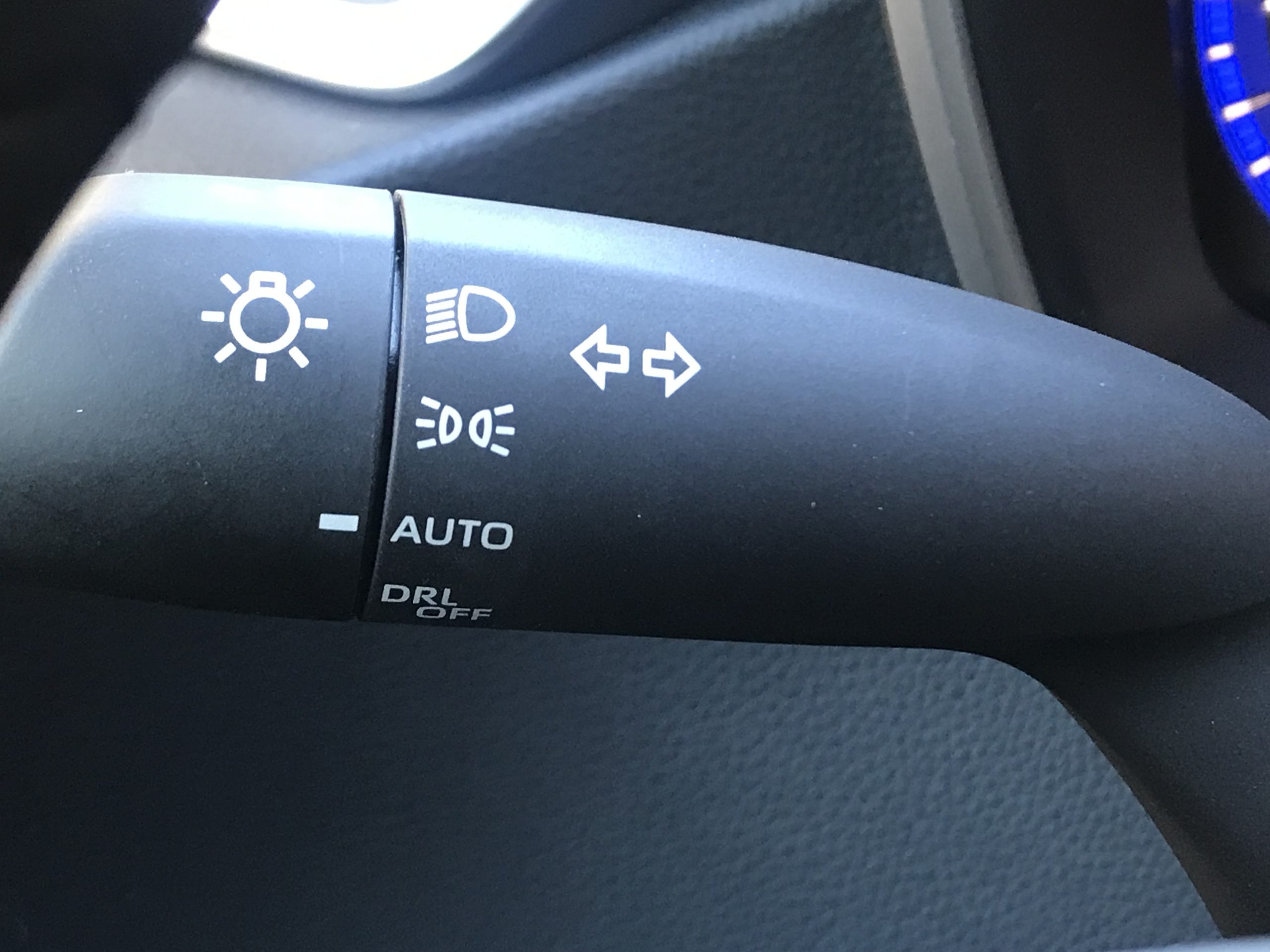 The auto headlight setting shown on a 2022 Toyota Corolla stalk