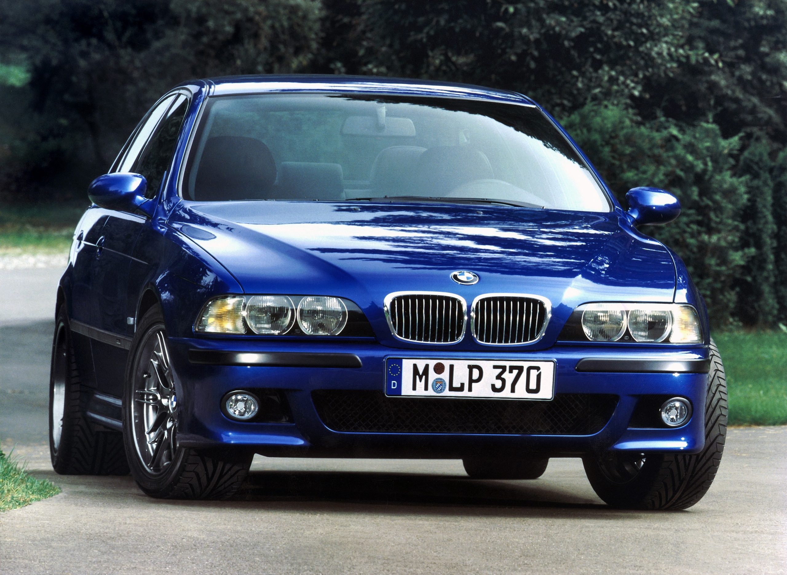 A blue E39 BMW M5 shot from the font 3/4 angle