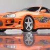 The Fast and Furious Supra as seen in a photo studio with a reflective floor
