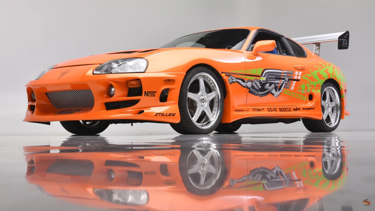 The Fast and Furious Supra  as seen in a photo studio with a reflective floor
