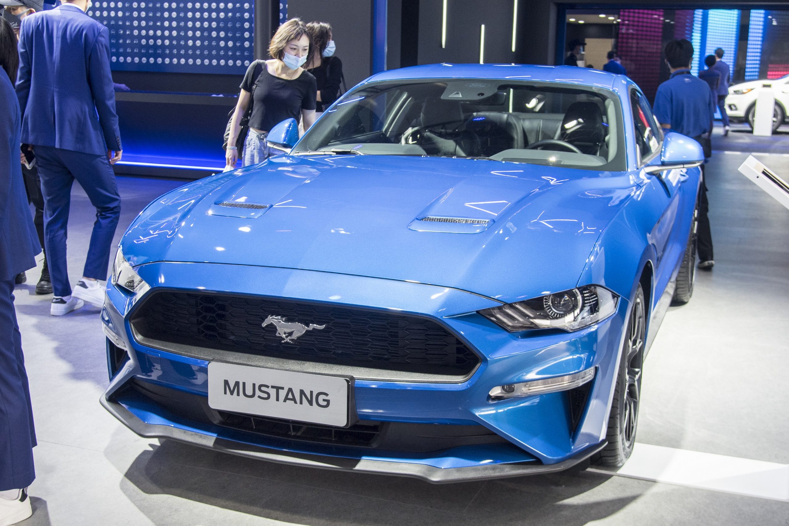 A dark blue 2020 Ford Mustang shot from the 3/4 angle at an auto show in China