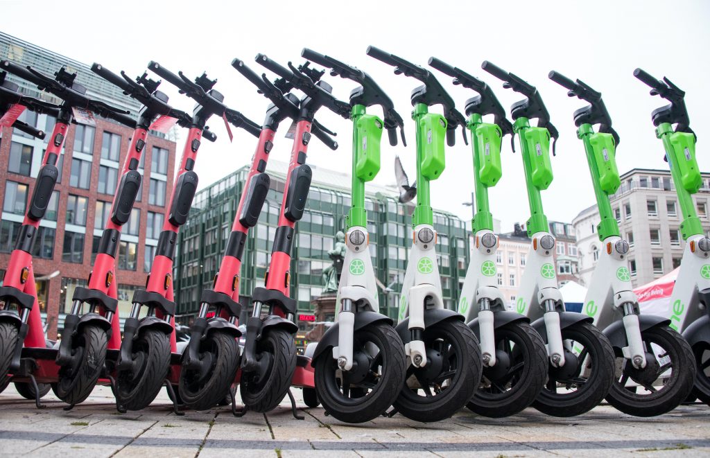  E-scooters from voi (left) and lime (right) stand next to each other during a driving safety training session. 