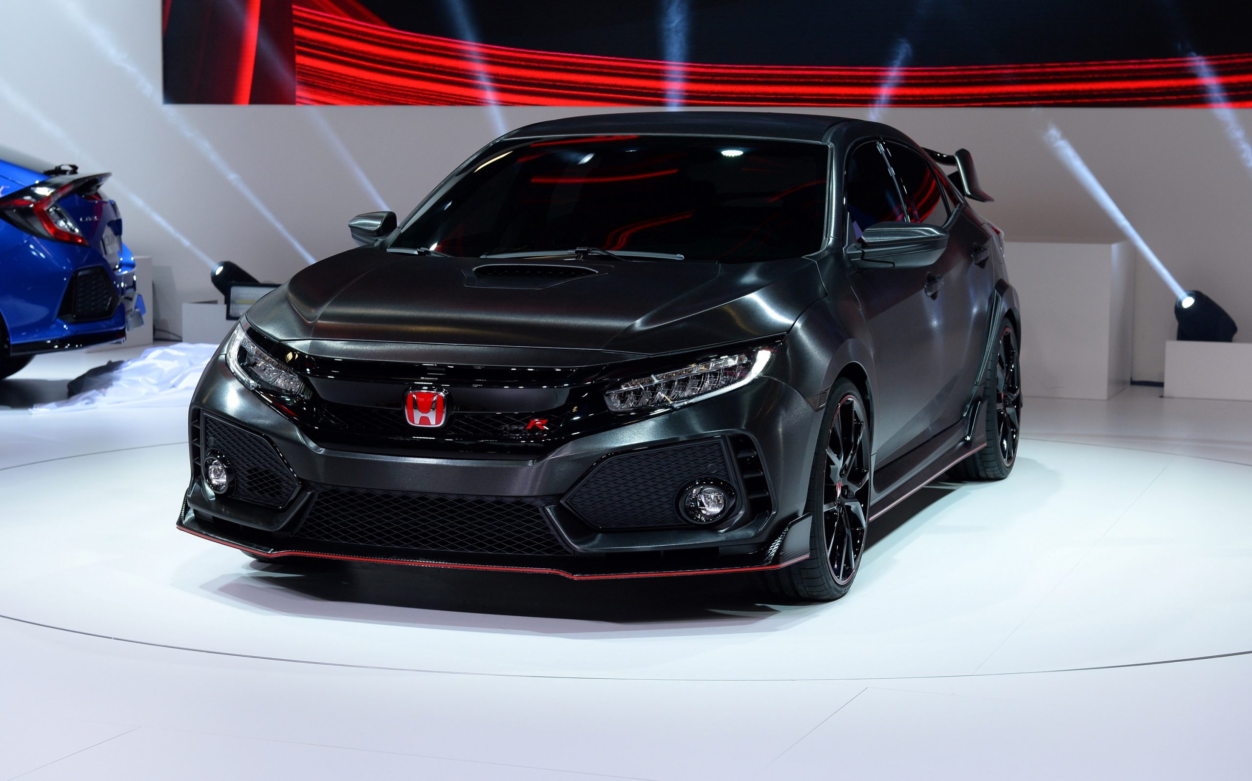 A black 2022 Honda Civic Type R shot at a motor show in Paris