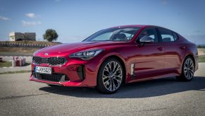 A red Kia Stinger GT shot from the front 3/4