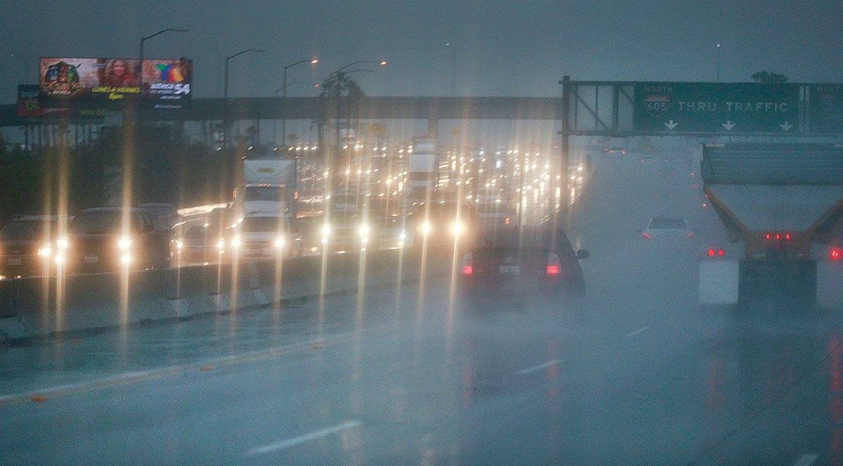 A rainy Los Angeles freeway filled with traffic