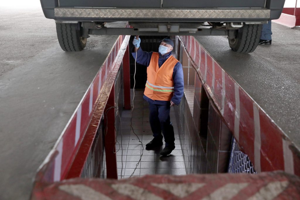  A mechanic examines an ambulance at the Kyivmedspetstrans Communal Enterprise, Kyiv, capital of Ukraine.