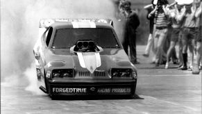 1979 Oldsmobile Starfire funny car doing a burnout on an aircraft carrier