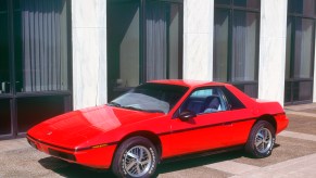 1983 Pontiac Fiero parked outside
