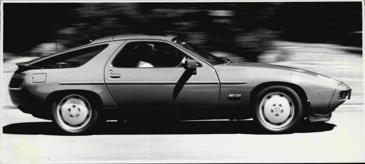 Porsche 928 driving on the road