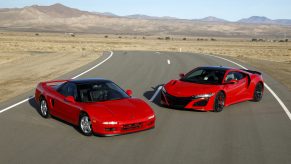 A pair of red Acura NSX sports cars shot side by side in profile