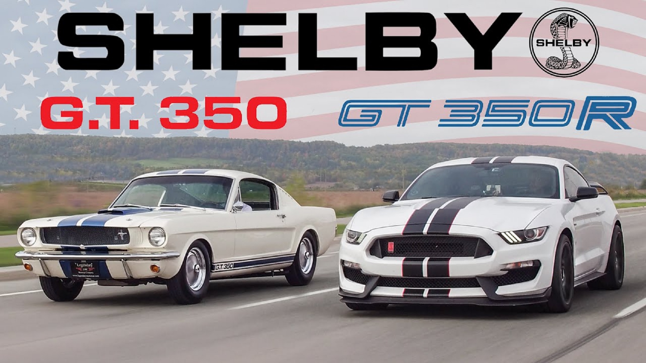 A white-with-blue-stripes 1965 Ford Mustang Shelby GT350 driving next to a white-with-blue-stripes 2020 Ford Mustang Shelby GT350R on the street