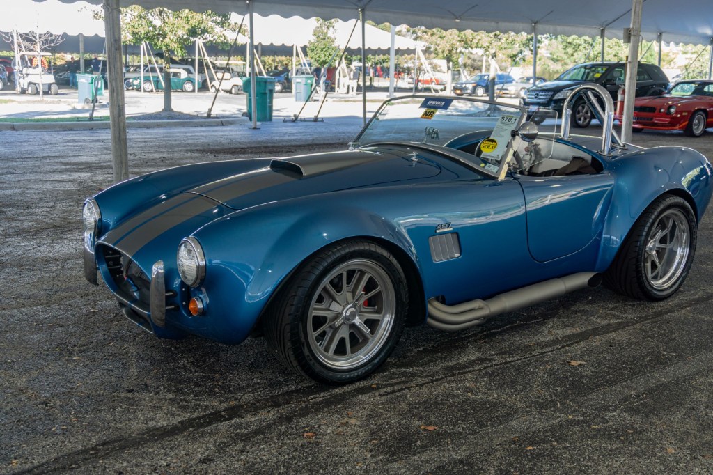 A blue-and-silver 1965 Ford Shelby Cobra replica at the 2021 Chicago Mecum auction