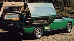 The rear 3/4 view of the green 1972 Toyota RV-2 concept with its rear panels open