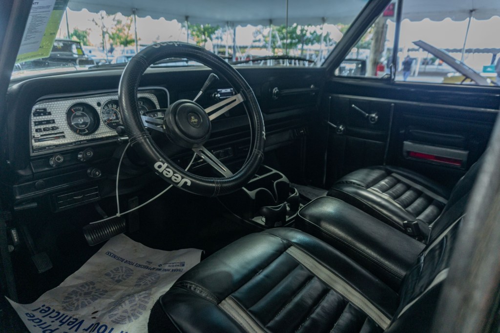 The black-and-stainless-steel interior of a restored 1981 Jeep J10