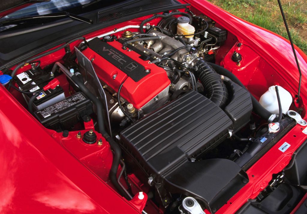 The 2.0-liter 'F20C' four-cylinder engine in the bay of a red 2003 'AP1' Honda S2000