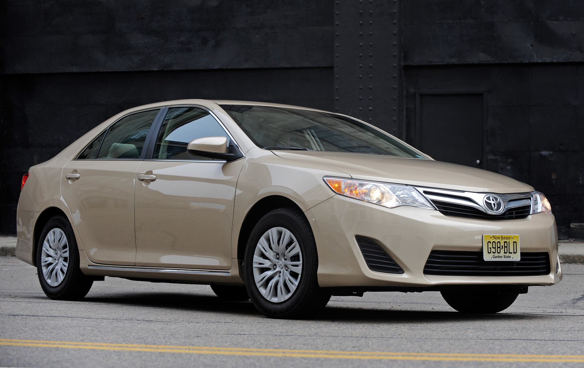 A Toyota Camry, one of the best used midsized cars, shot from the front 3/4