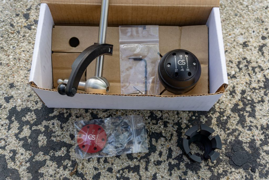 A 2013 Fiat 500 Abarth CravenSpeed short-throw shifter kit with retaining clip and accessory cover