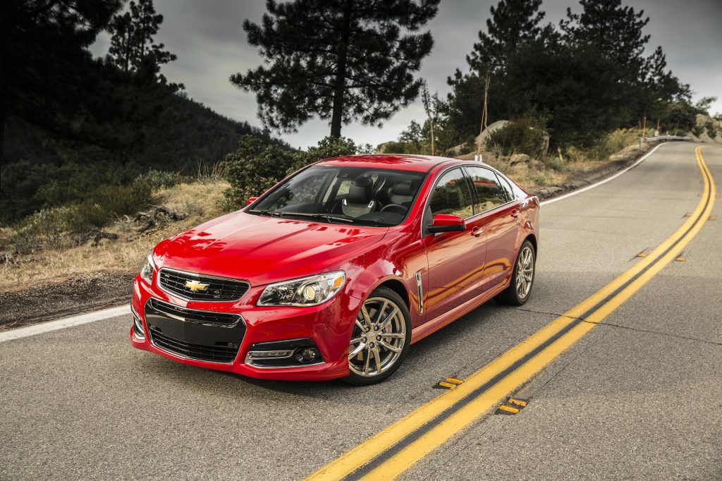 2014 Chevrolet SS shown in red driving down a road