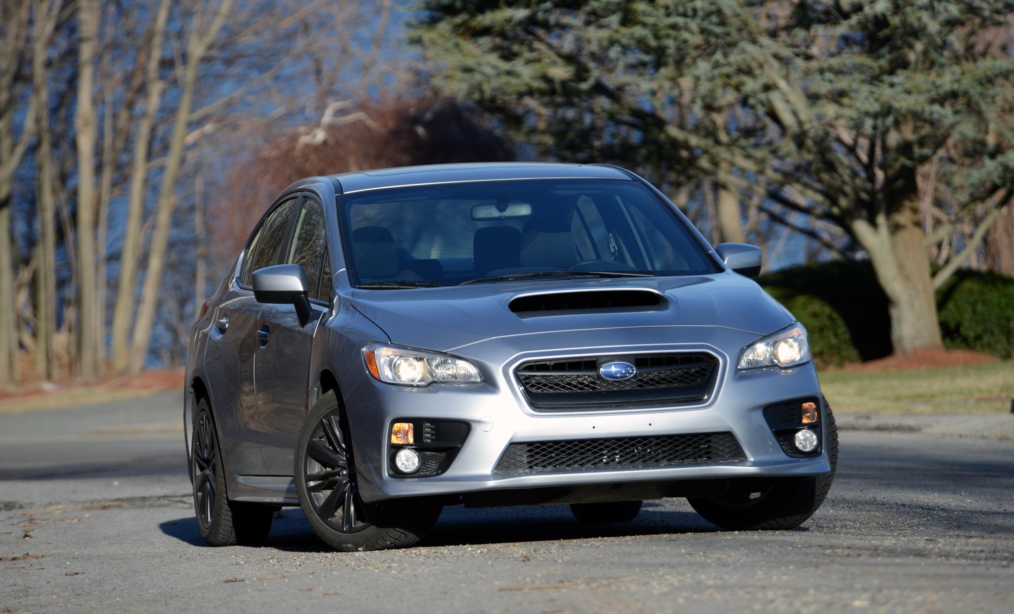 A silver Subaru WRX shot from the front