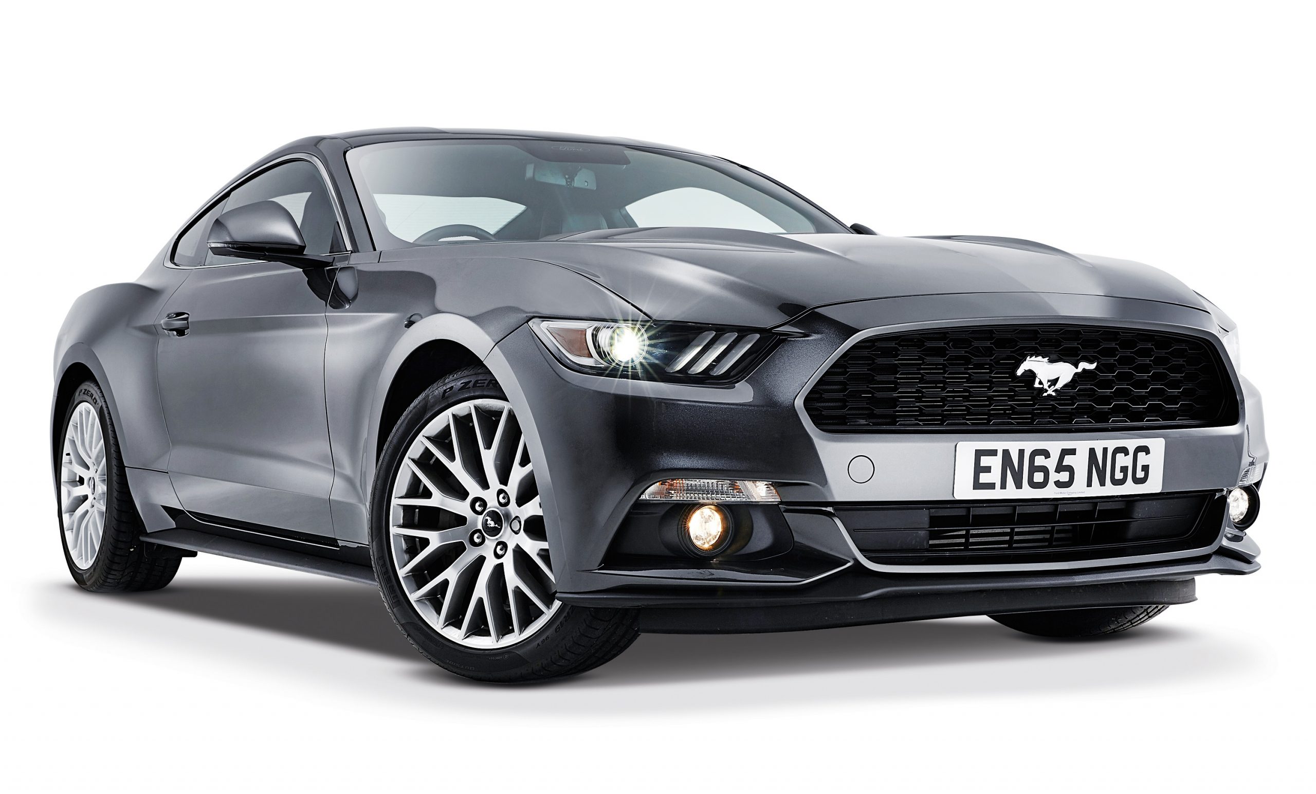 A grey 2016 Ford Mustang EcoBoost shot in a photo studio from the front 3/4
