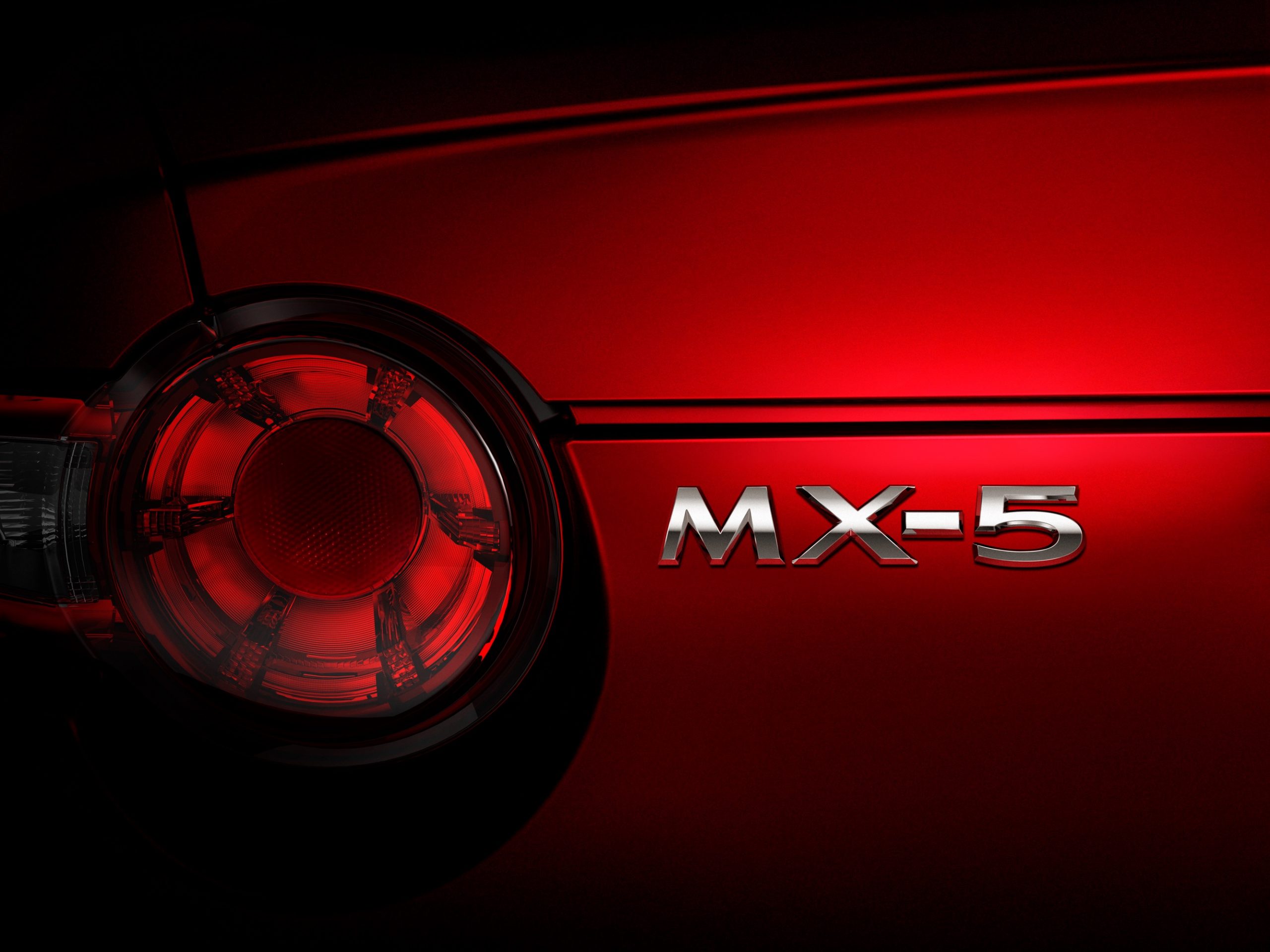 The MX-5 badge on the new Mazda Miata in red