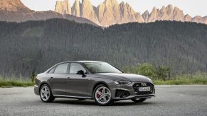 A grey 2021 Audi S4 shot from the front 3/4 on a mountain pass