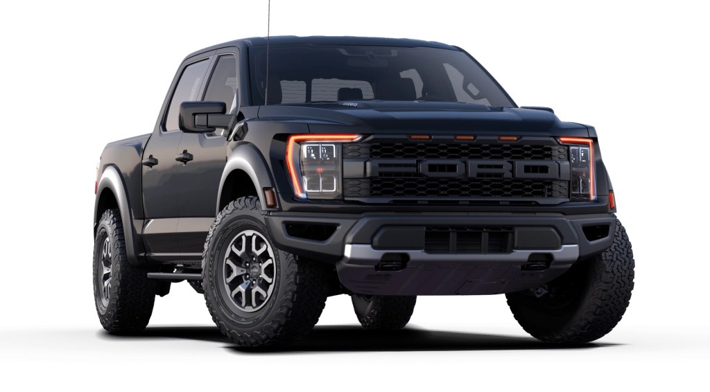 A black 2021 Ford F-150 Raptor against a white background. The 2021 F-150 can get a 700 horsepower supercharger kit for its Coyote V8 engine.