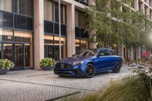 The 2021 Mercedes-Benz AMG E-Class 63 S wagon with a blue paint color option parked on a stone tile plaza
