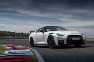 The 2021 Nissan GT-R NISMO luxury sports car with a white paint color option parked on a racetrack