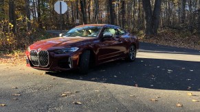 2022 BMW M440i review unit is metallic red parked on the road