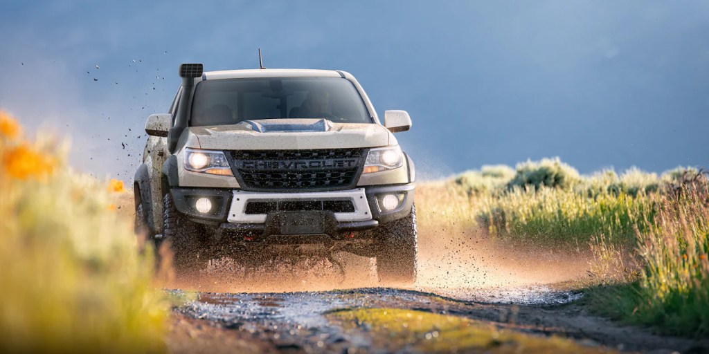 A 2022 Chevrolet Colorado pickup truck rips through the mud with its off-road capability
