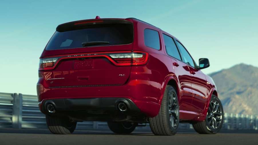 A red 2022 Dodge Durango parked in front of mountains.