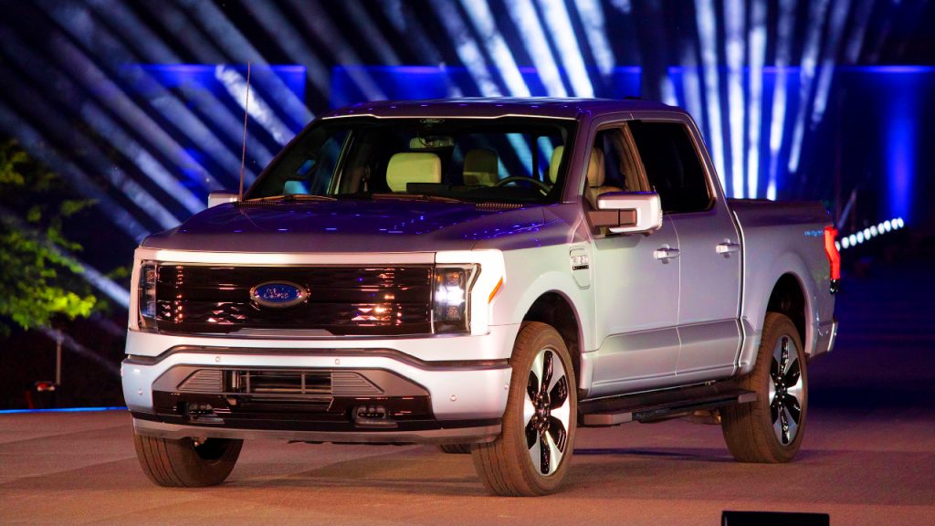 A silver 2022 Ford F-150 Lightning is on display.