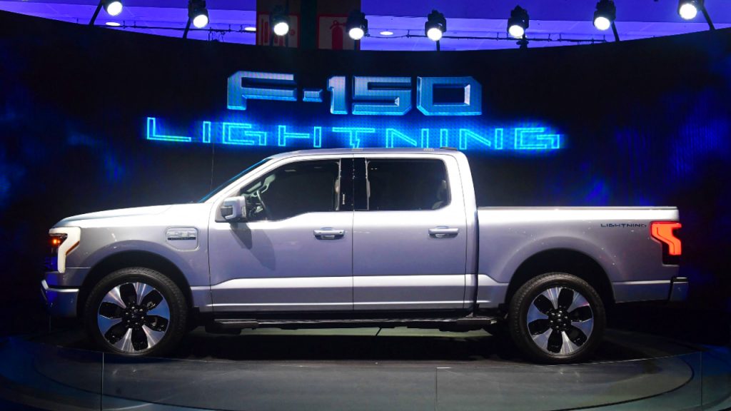 A silver 2022 Ford F-150 Lightning is on display.